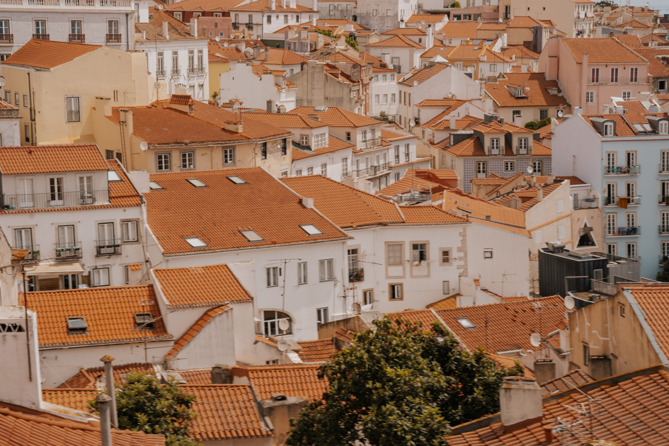 panoramic of red tile roofs on white buildings on a Lisbon itinerary 2 days