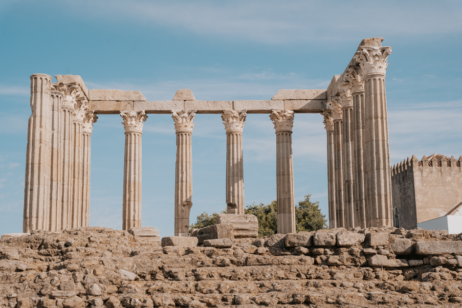 ancient Roman temple ruins with pillars and stone wall in Evora, Portugal
