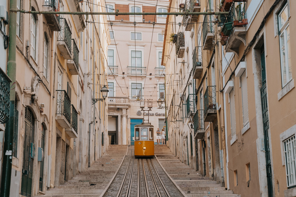 yellow Bica furnicular on a track in historic Chiado neighbourhood, the best neighbourhood in Lisbon for first time visitors