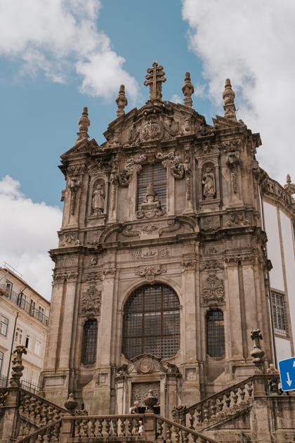 Clerigos Church with its romanesque facade on a partly cloudy day is where to stay in Porto for first time visitors