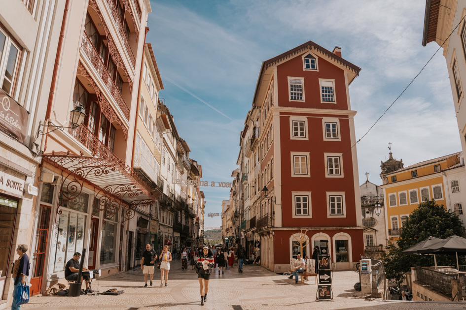 Where to stay in Portugal's Silver Coast for history lovers on a bustling commerce street in Coimbra
